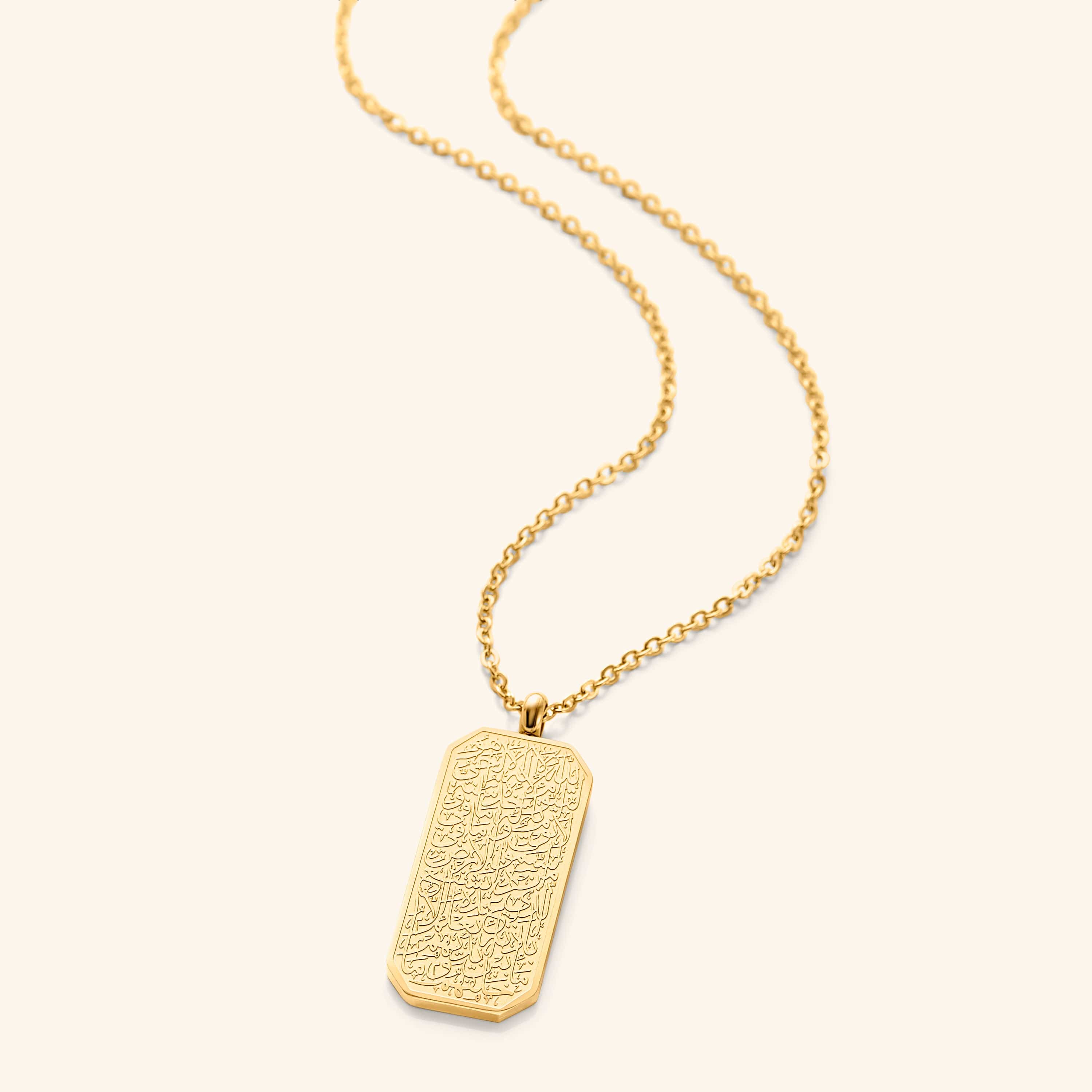 An 18k gold plated necklace Ayatul Kursi engraved on the tag. The pendant is hanging on a thin gold plated chain.