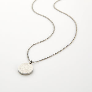 Silver necklace with a circular pendant engraved with 'Alhamdulillah' calligraphy, displayed on a white background.