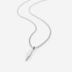 Silver necklace with a palestine map-shaped pendant with arabic calligraphy engraved, shot on a white background