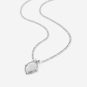 A silver necklace that features a pendant stamped with a line from Hadith Qudsi: "Walk to Me and I will run to you"