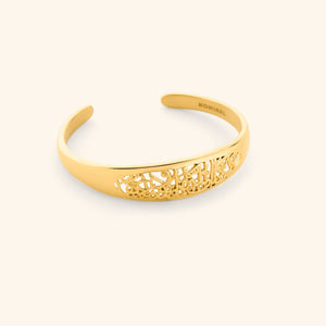 An 18k gold plated openwork cuff carved with verse 2:286: لَا يُكَلِّفُ ٱللَّهُ نَفْسًا إِلَّا وُسْعَهَا "Allah does not burden a soul beyond what it can bear."