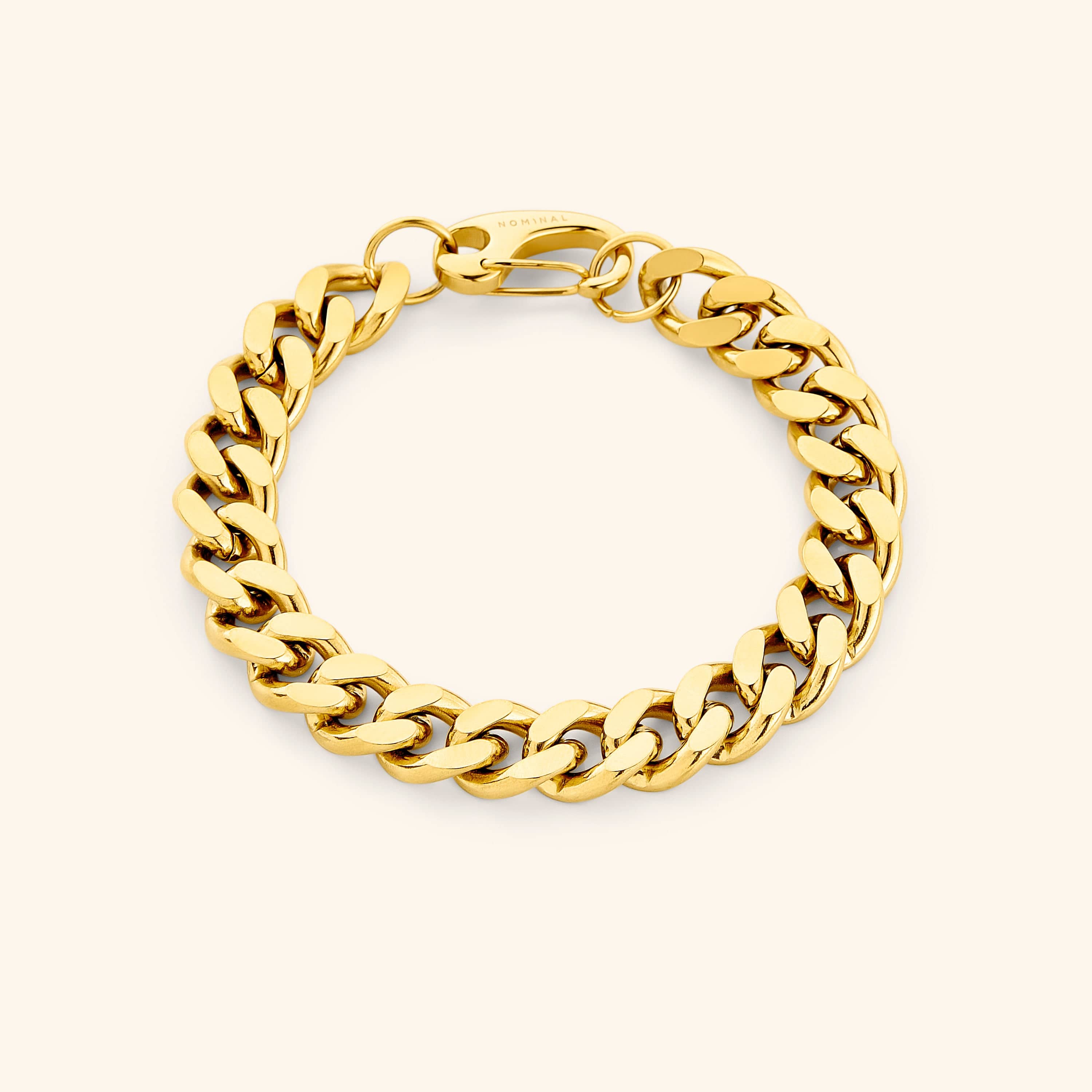 Flat lay of the 18k gold plated 10MM chunky cuban bracelet that features a closure clasp.