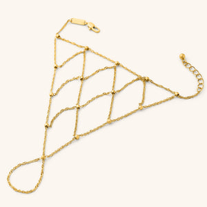 Gold Keffiyeh Fishnet Hand Chain featuring a lattice-style chain design with small gold beads.