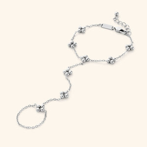 Close-up of the Henna Hand Chain in polished silver, featuring the same henna-inspired floral pattern design.