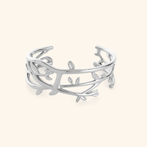 Silver Imperfect Olive branch cuff on a light background