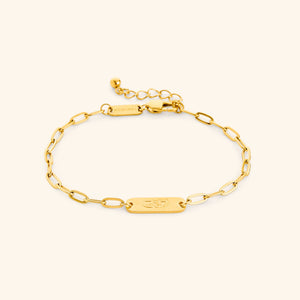 Gold My Sister Ukhti link bracelet showing the Arabic engraving on center tag, photographed against a light background.