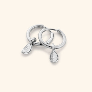 The Watermelon Hoops in a polished silver finish, showcasing the semi-circular watermelon slice design with red enamel, black seeds, and green rind detailing, representing the Palestinian flag colors.