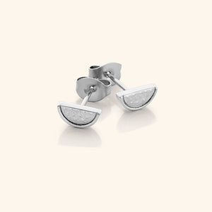The Watermelon Studs in a polished silver finish, showcasing the semi-circular watermelon slice design with red enamel, black seeds, and green rind detailing, representing the Palestinian flag colors.