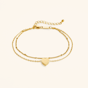 Flat lay of the 18k gold plated Dotted & Heart Stacker Anklet
