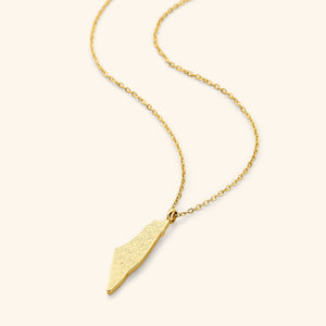 A gold-plated necklace featuring a pendant shaped like a country map, engraved with Arabic calligraphy of Ayatul Kursi, displayed on a white background.