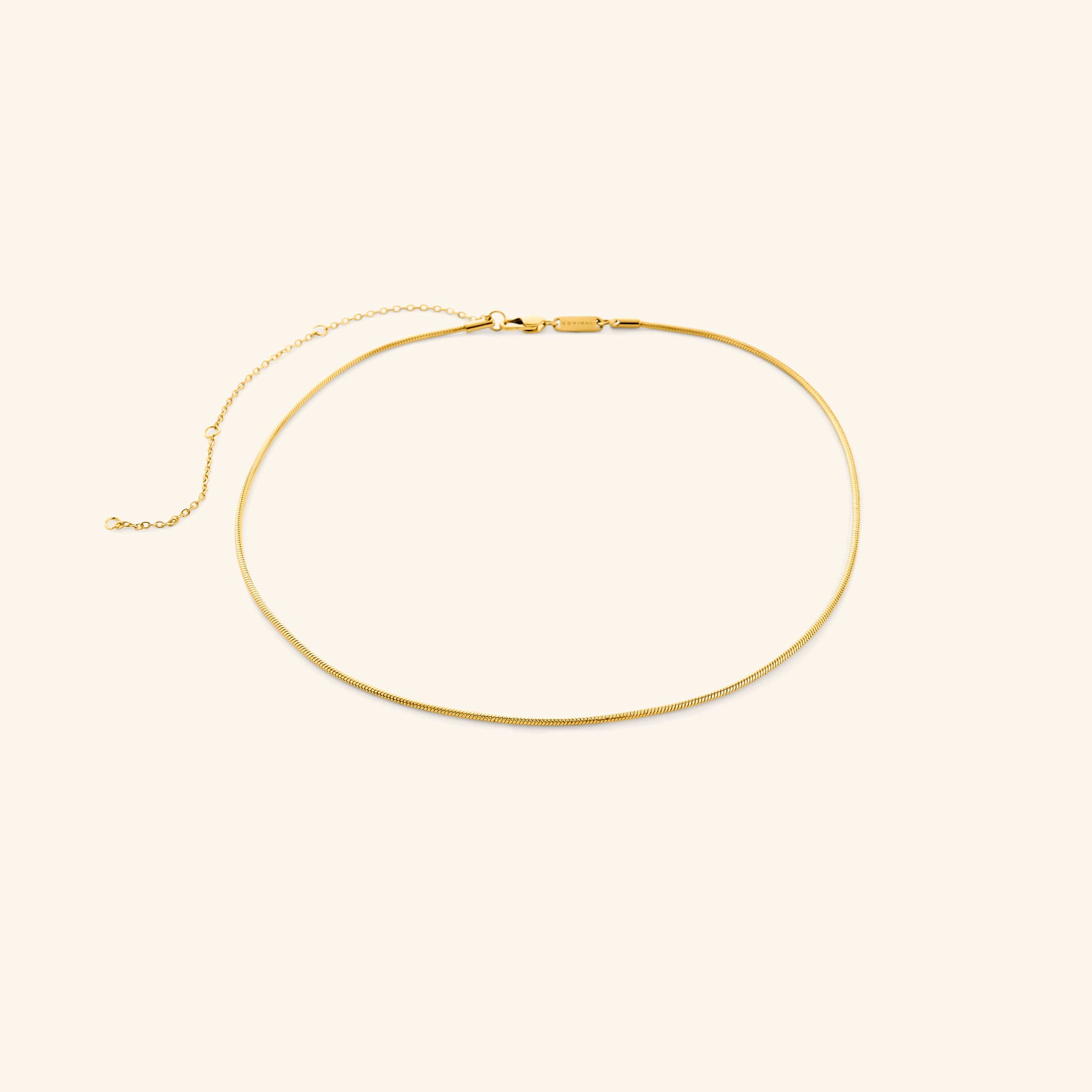 Gold harmony necklace on a white background