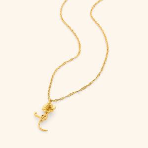 Flat lay of gold Jaan Rose necklace