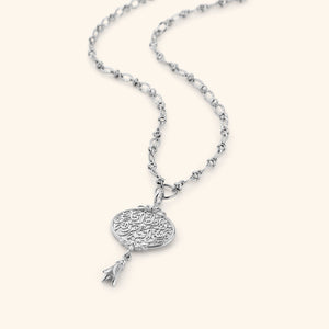 A medallion-shaped silver necklace carved with a line from Hadith Qudsi: "Walk to Me and I will run to you." This pendant is suspended with a unique chain that interconnects oval shaped ridged links.