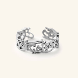 The "Perhaps you dislike something which is good for you" Calligraphy Ring in silver, shown close-up on a neutral background.