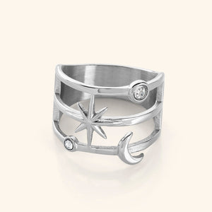 The Galaxy Stack Ring in a polished silver finish, showcasing an openwork design with two luminous bezels, a radiant six-pointed star, and a delicate crescent