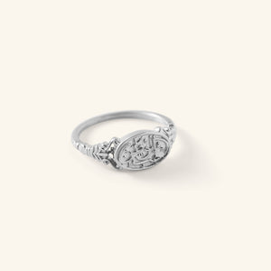 Silver Homeland Ring with an oval face engraved in Arabic calligraphy and a decorative band, shown against a neutral background.