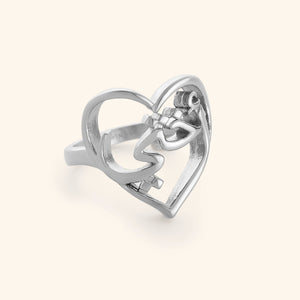 Silver ring with Arabic Calligraphy for "My Sister" wrapped into a heart design.