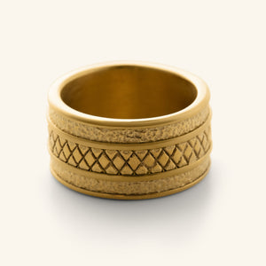 Gold Palestine Tribute Ring featuring a wide band with textured edges and a diamond-patterned center design.