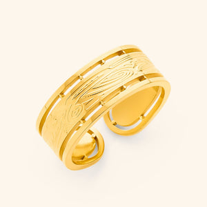 Gold Sabireen ring with intricate Arabic calligraphy and cutout border design, displayed against a neutral background.