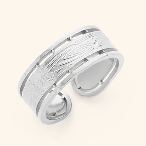 Silver Sabireen ring with intricate Arabic calligraphy and cutout border design, displayed against a neutral background.
