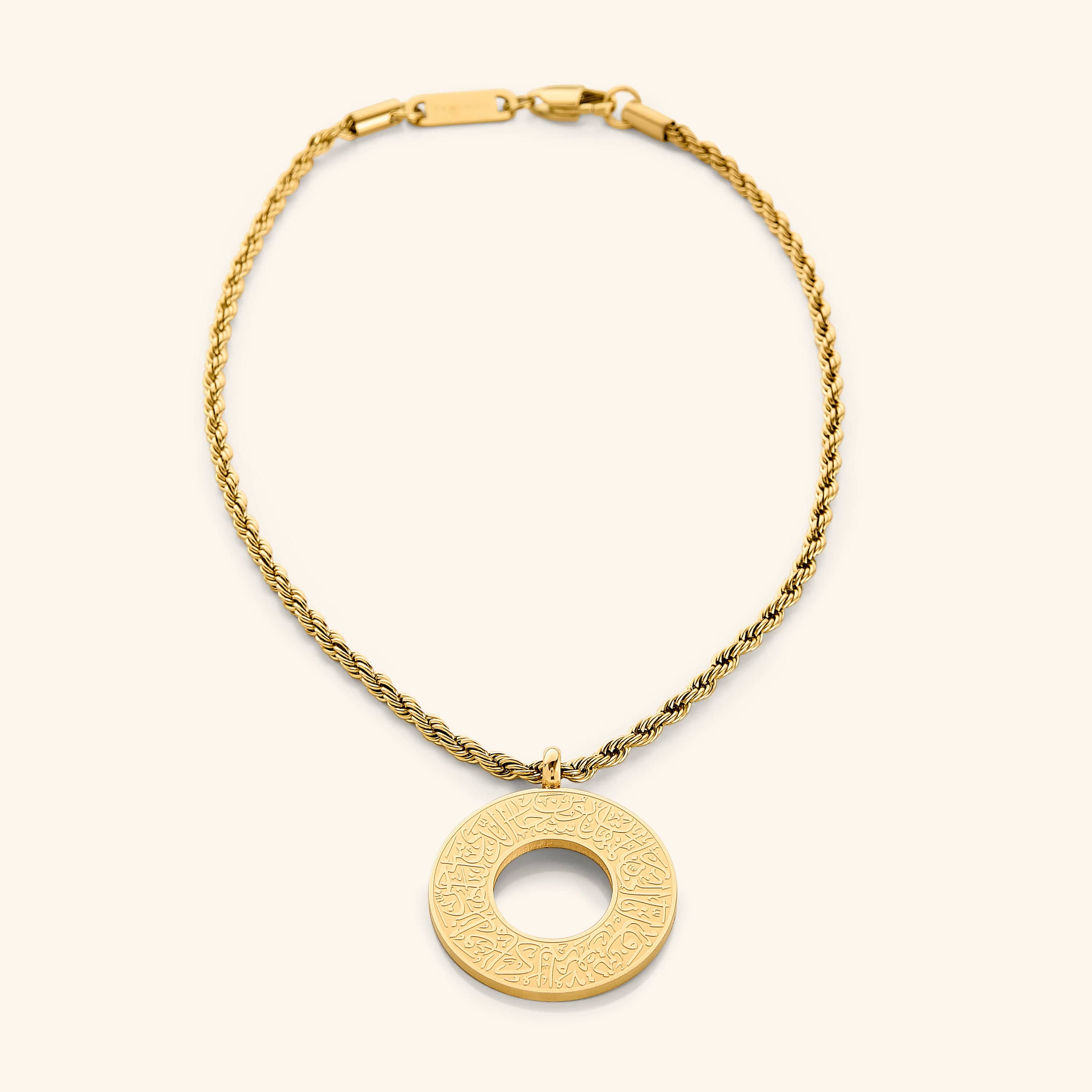 Gold circular car hanger with an open circle center, engraved with Duaa Al-Safar in Arabic calligraphy on a neutral background.