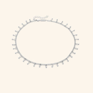 A close-up of the Dangling Dotted Choker in silver. The choker features a delicate chain with evenly spaced 3mm spherical bead accents that dangle, creating a subtle and elegant design.