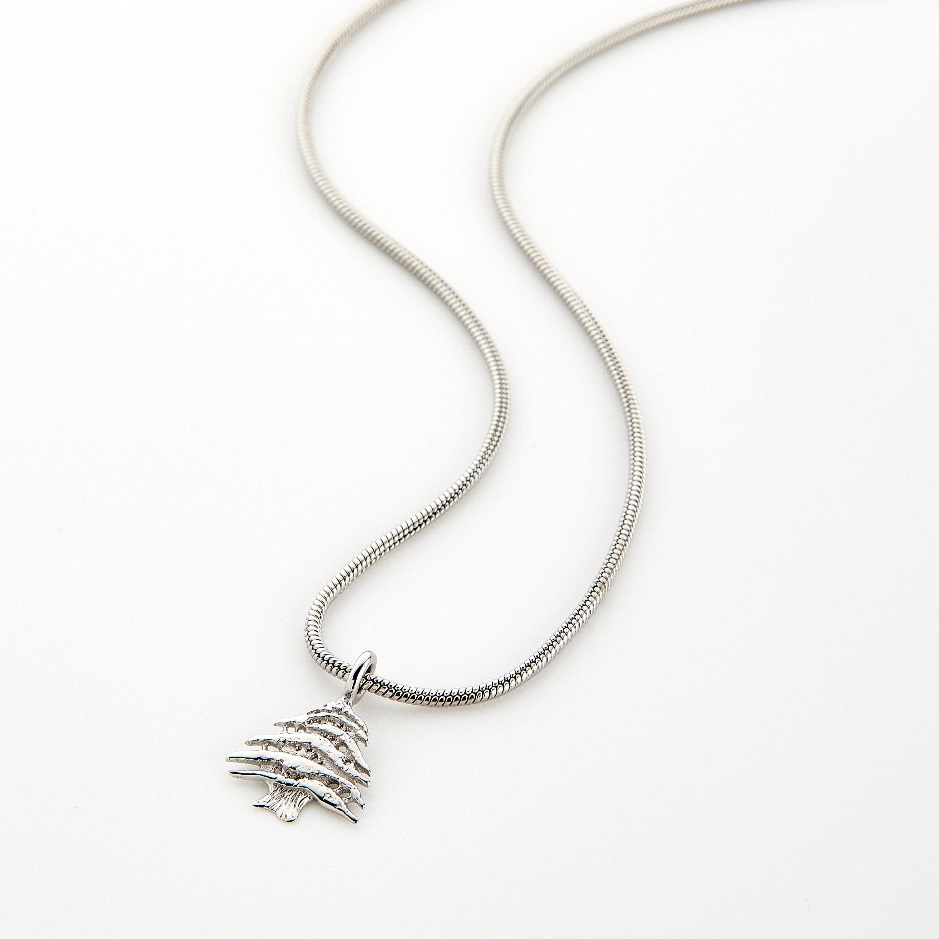 Silver necklace with a Cedar of Lebanon tree pendant, displayed on a white background.