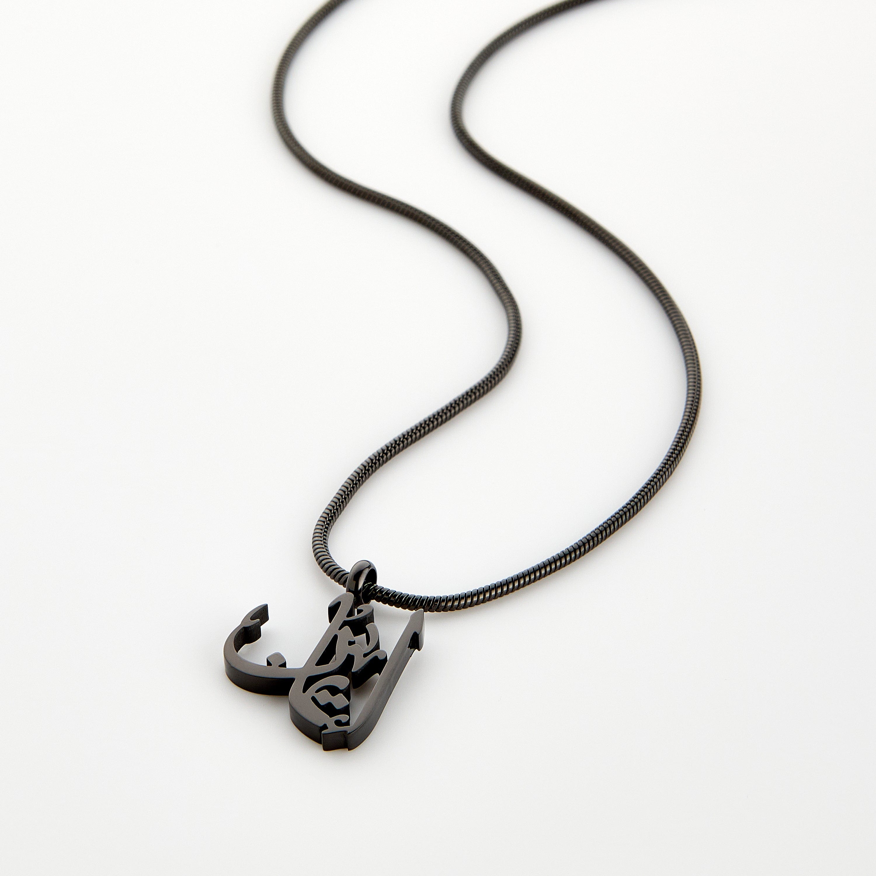 Black calligraphy necklace spelling 'Faith' in Arabic on a matching black chain, displayed on a white background.