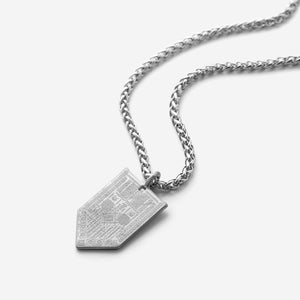Silver Hanging Tatreez Necklace for men with a pointed pendant engraved in traditional Tatreez patterns.