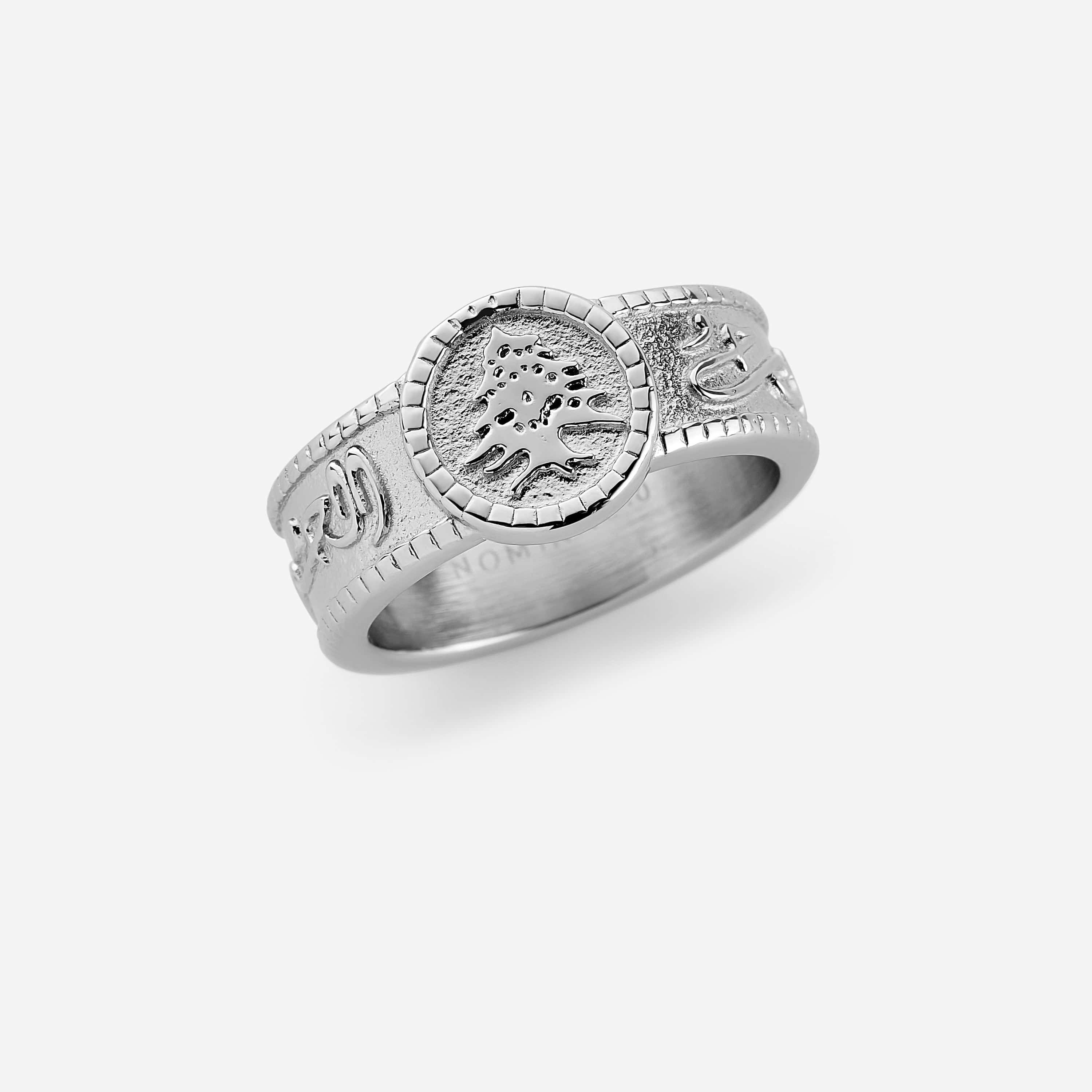 Silver ring that features the Cedar of Lebanon tree embossed onto the front plate and "freedom is the soul" engraved in Arabic calligraphy around the beveled band.