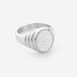 A silver ring stamped with a line from Hadith Qudsi: "Walk to Me and I will run to you"