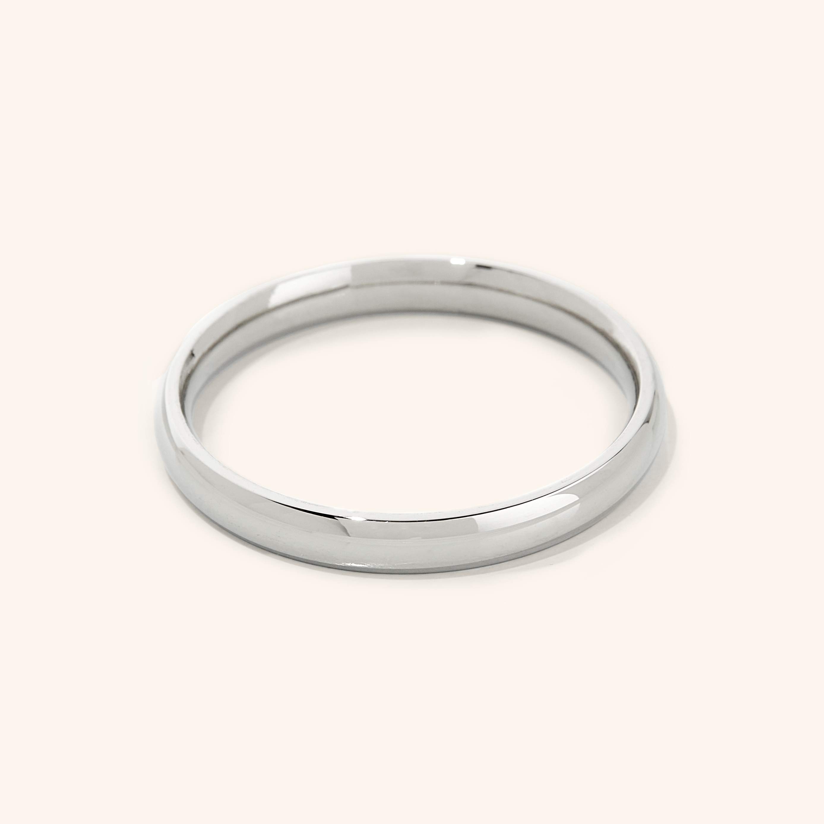 Silver band ring displayed on a white background.