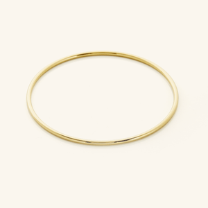 Picture of a thin gold bangle.
