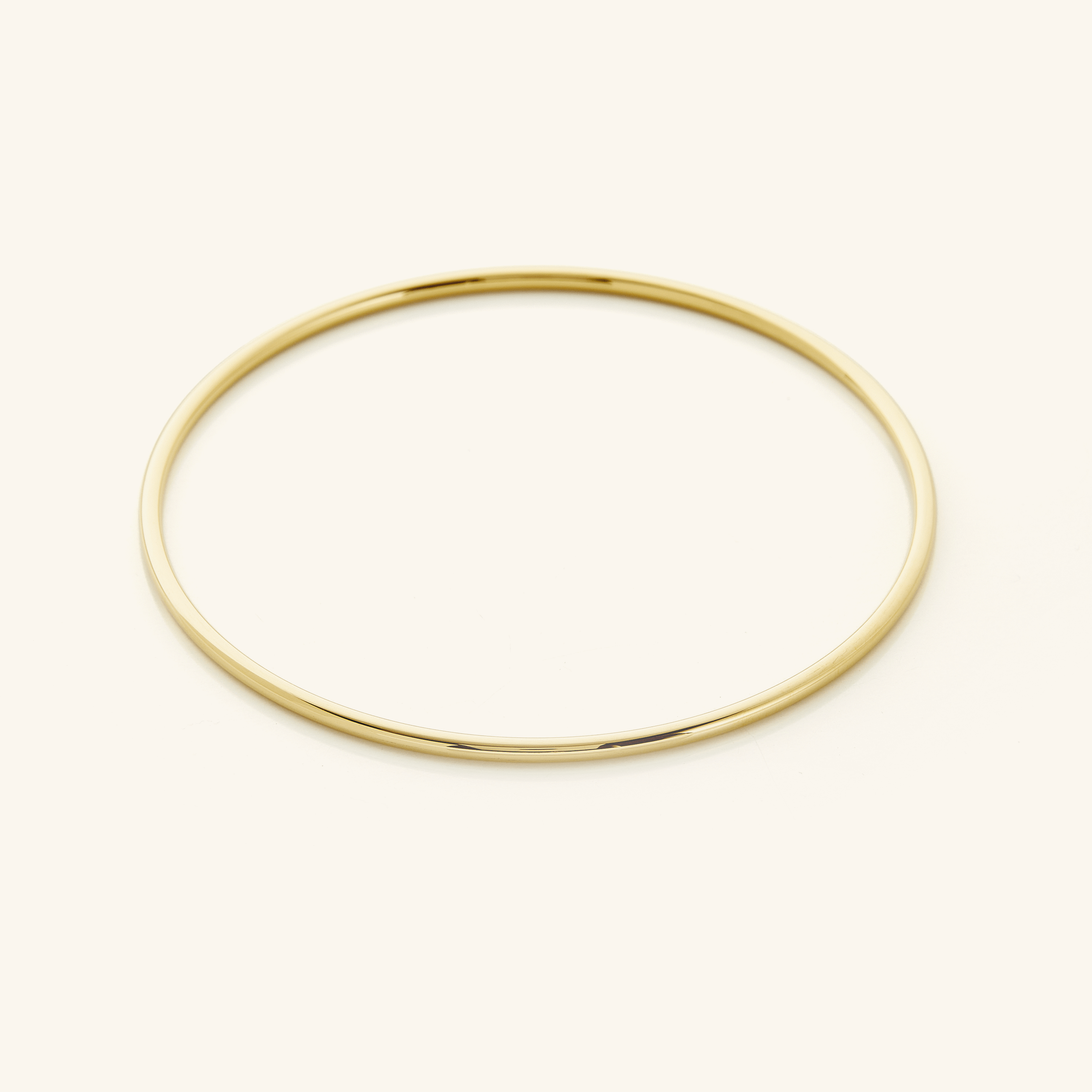 Picture of a thin gold bangle.