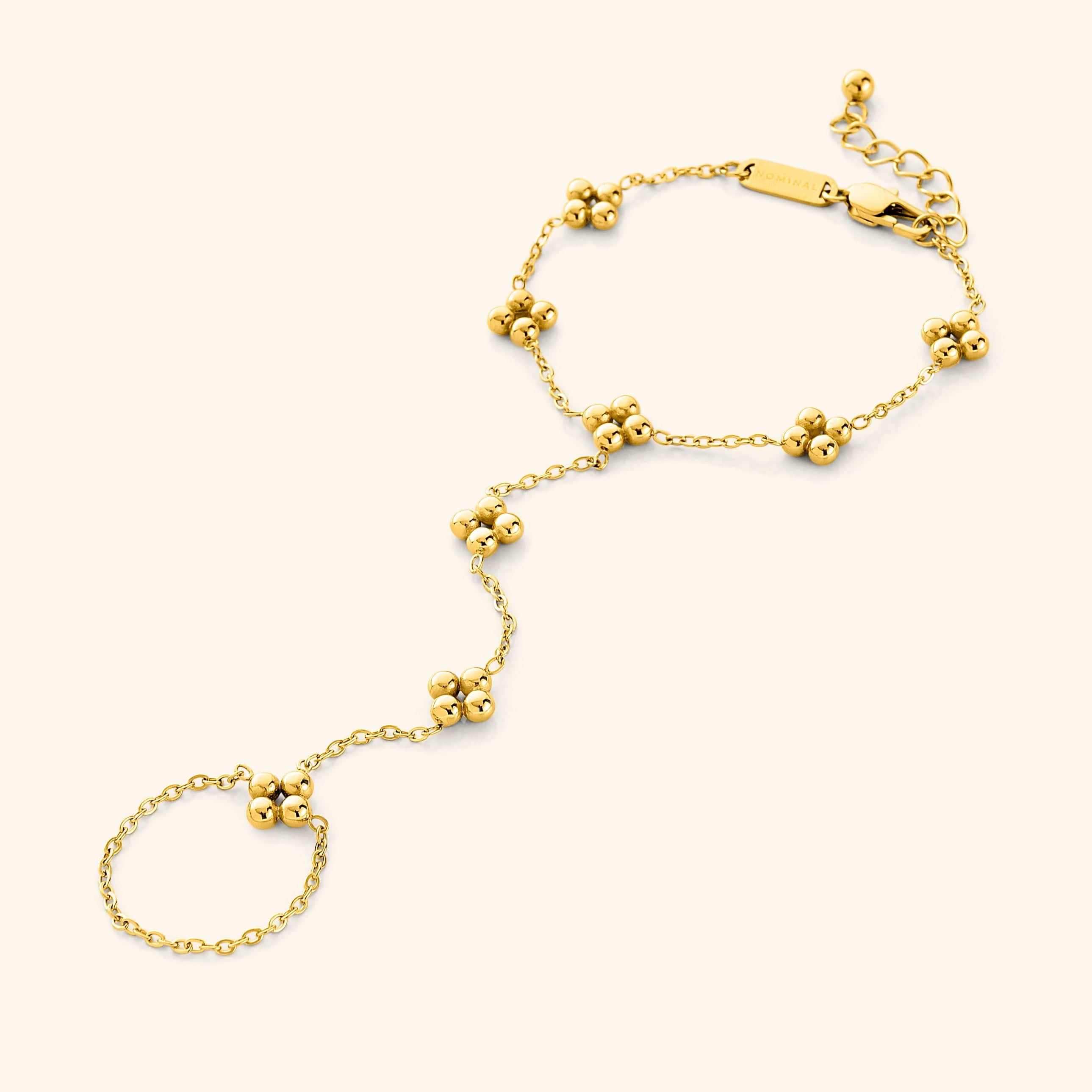 Close-up of the Henna Hand Chain in 18K gold plating, featuring intricate henna-inspired floral patterns.