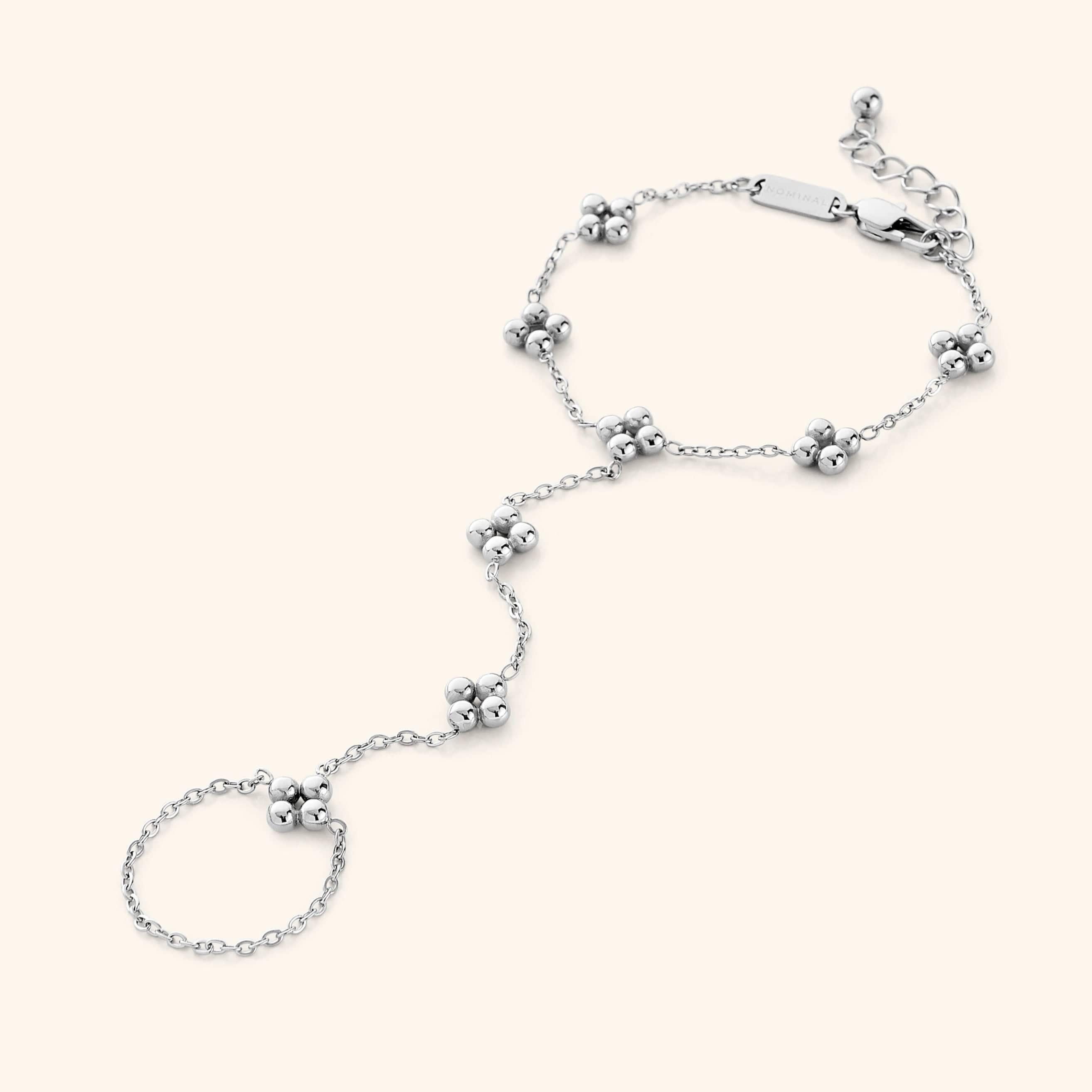 Close-up of the Henna Hand Chain in polished silver, featuring the same henna-inspired floral pattern design.