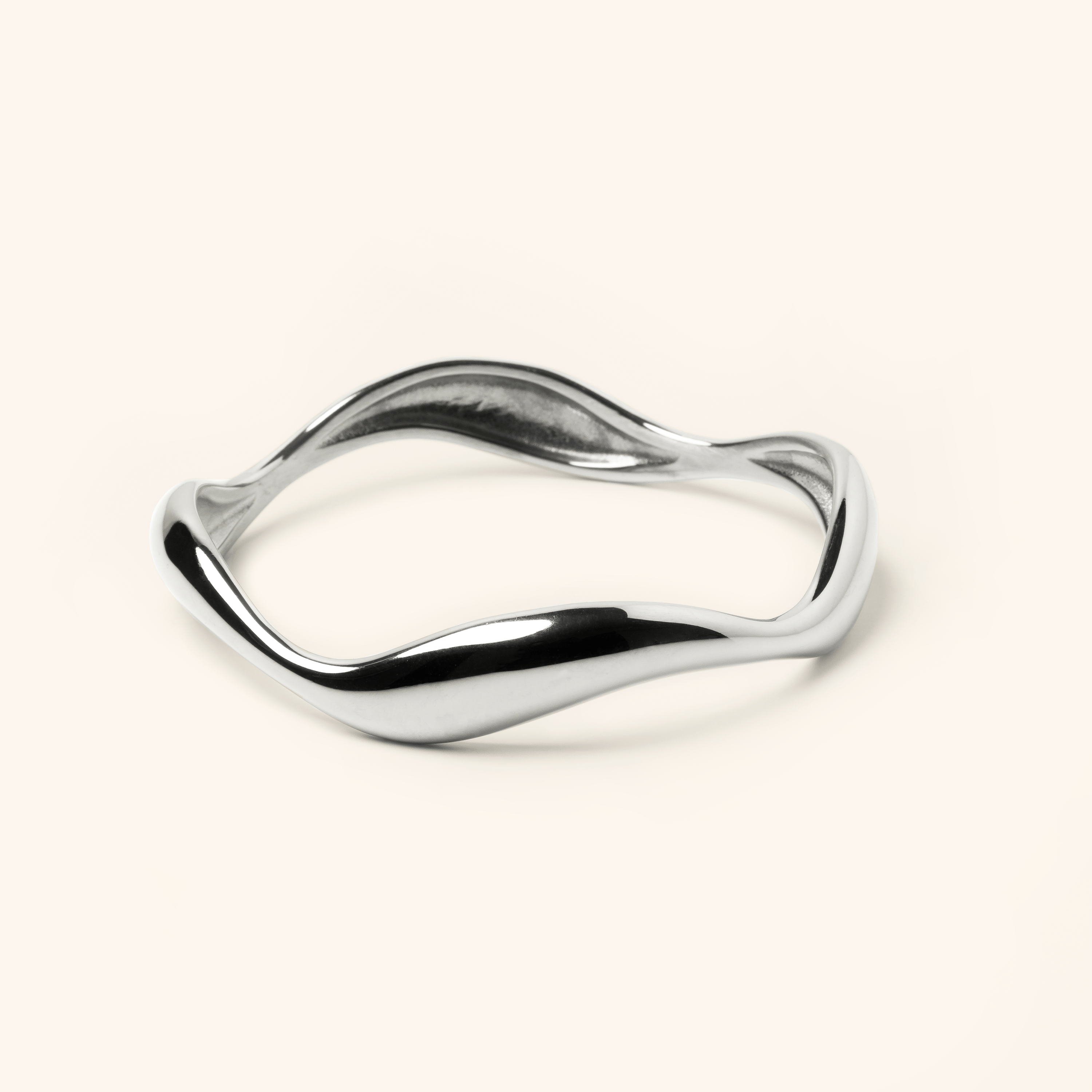 Photo of a silver Wave Bangle features cascading curves to remind you that life ebbs and flows.