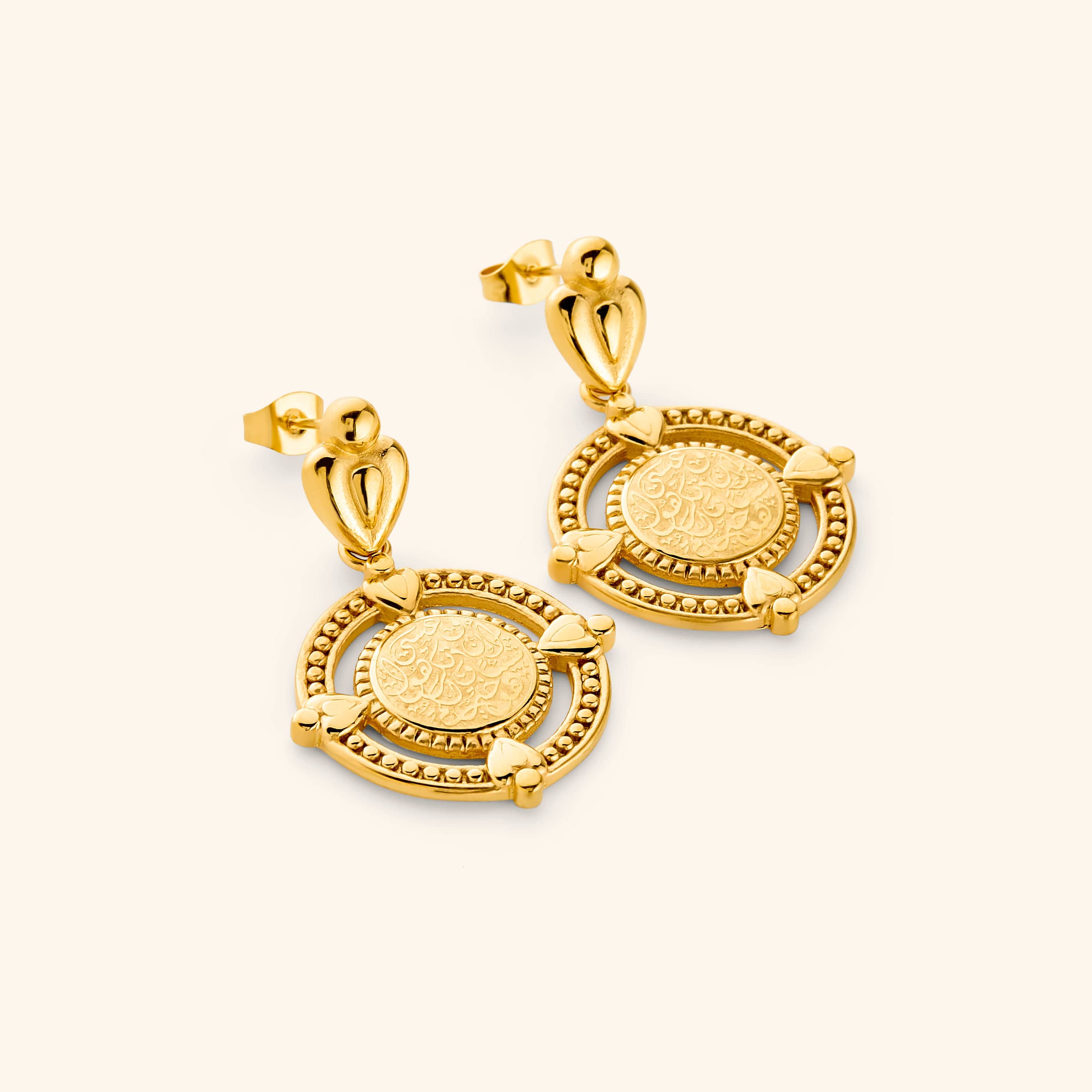 A pair of 18k gold plated dangling earrings that features the  "perhaps you dislike what's good for you" in Arabic calligraphy engraved at the center of the beaded coin. 