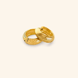 Gold keffiyeh mini hoops on a neutral background