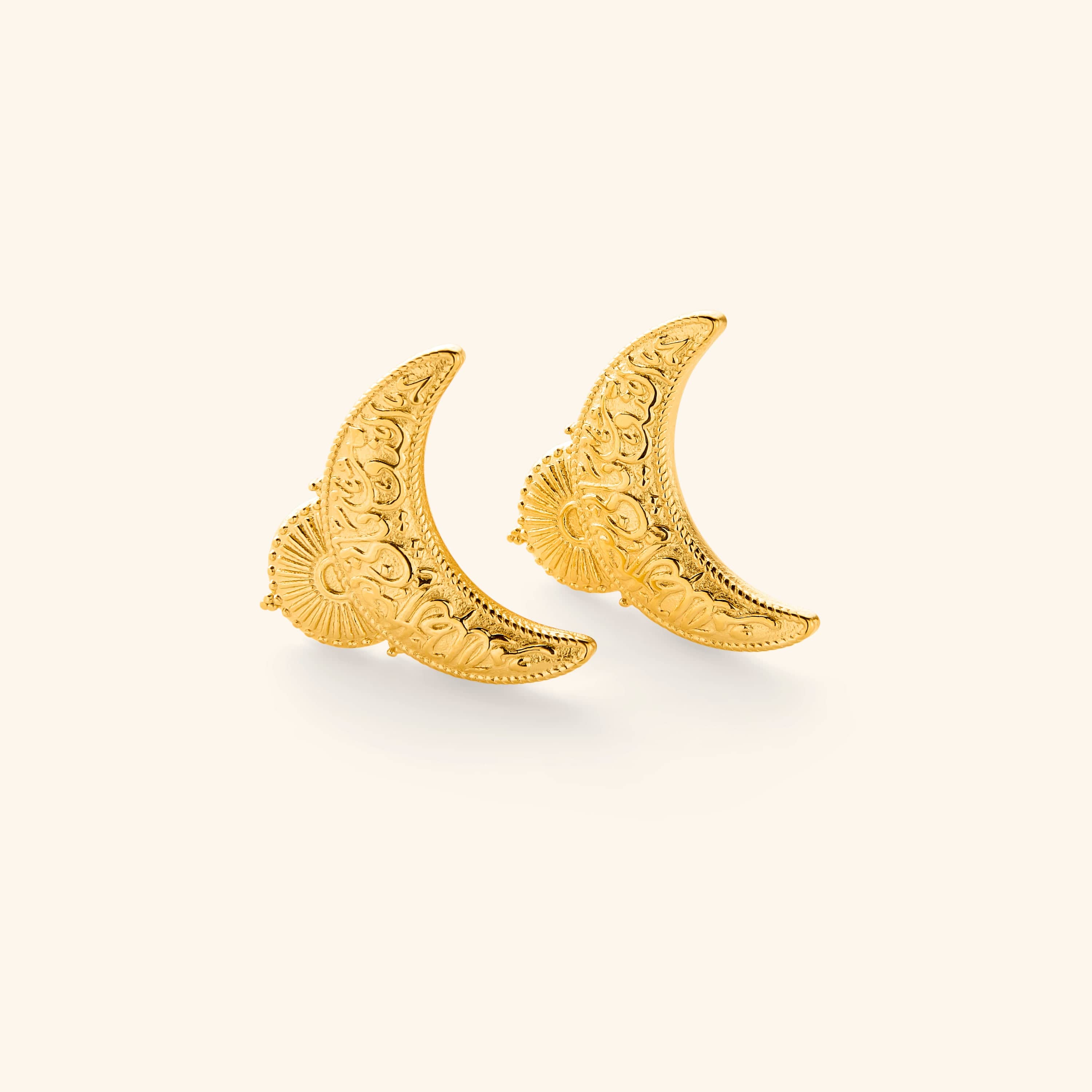 18K gold plated earrings shaped in an upside down crescent featuring an Arabic quote inscribed on each saying "light comes after darkness."