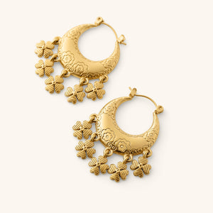 Gold Levantine Garden Hoop Earrings with floral engraving and dangling charms.