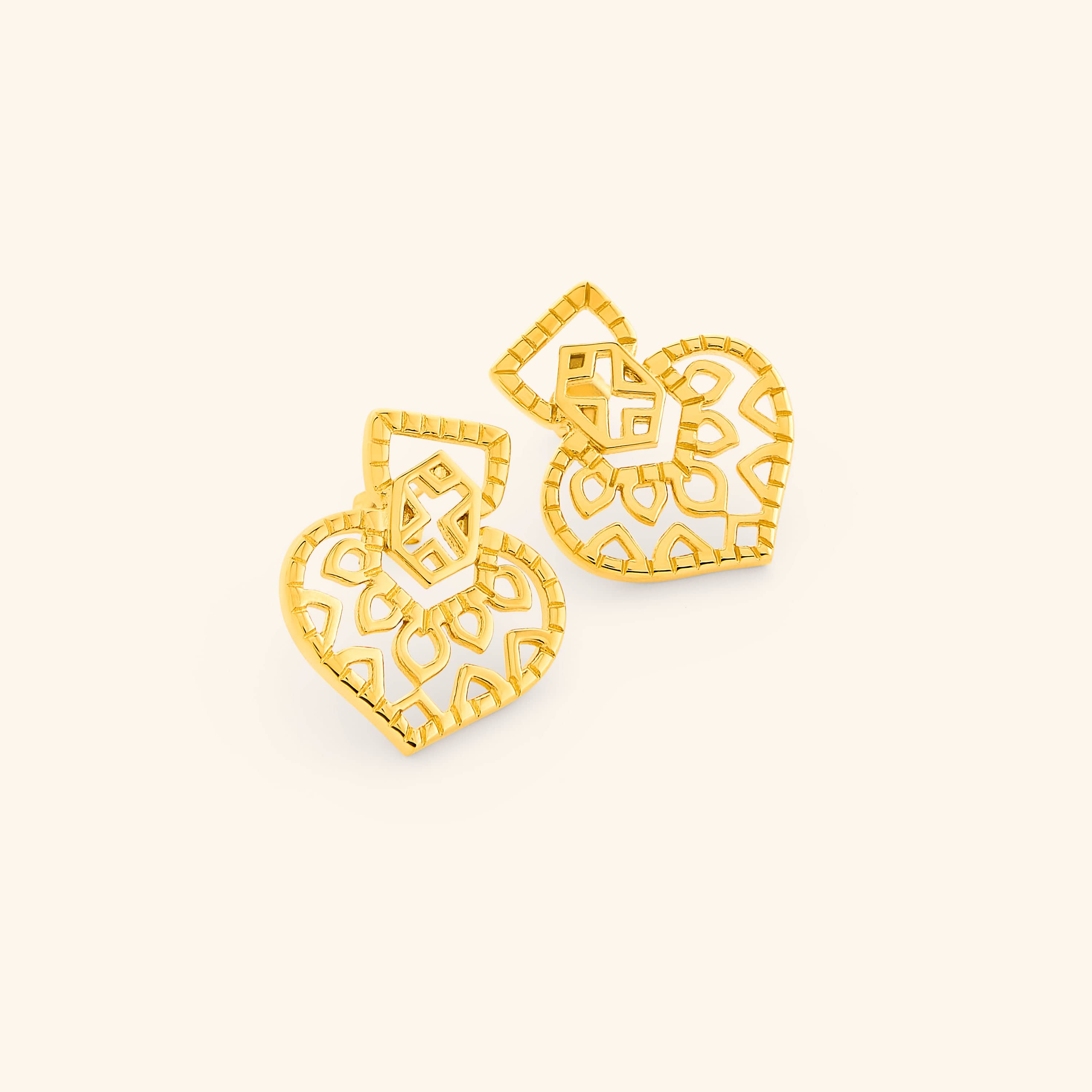 Pair of gold Mehndi Heart Earrings with openwork heart-shaped design and geometric detailing.
