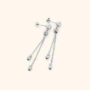 Pair of silver raining earrings featuring a polished stud with two slim chains, each ending in ribbed silver bead charms.