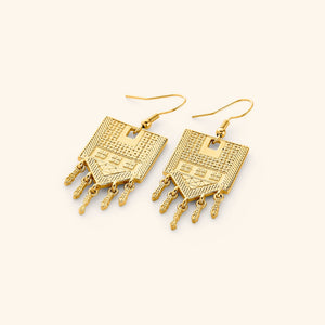 Pair of 18k gold plated statement earrings carved with motifs of tatreez.