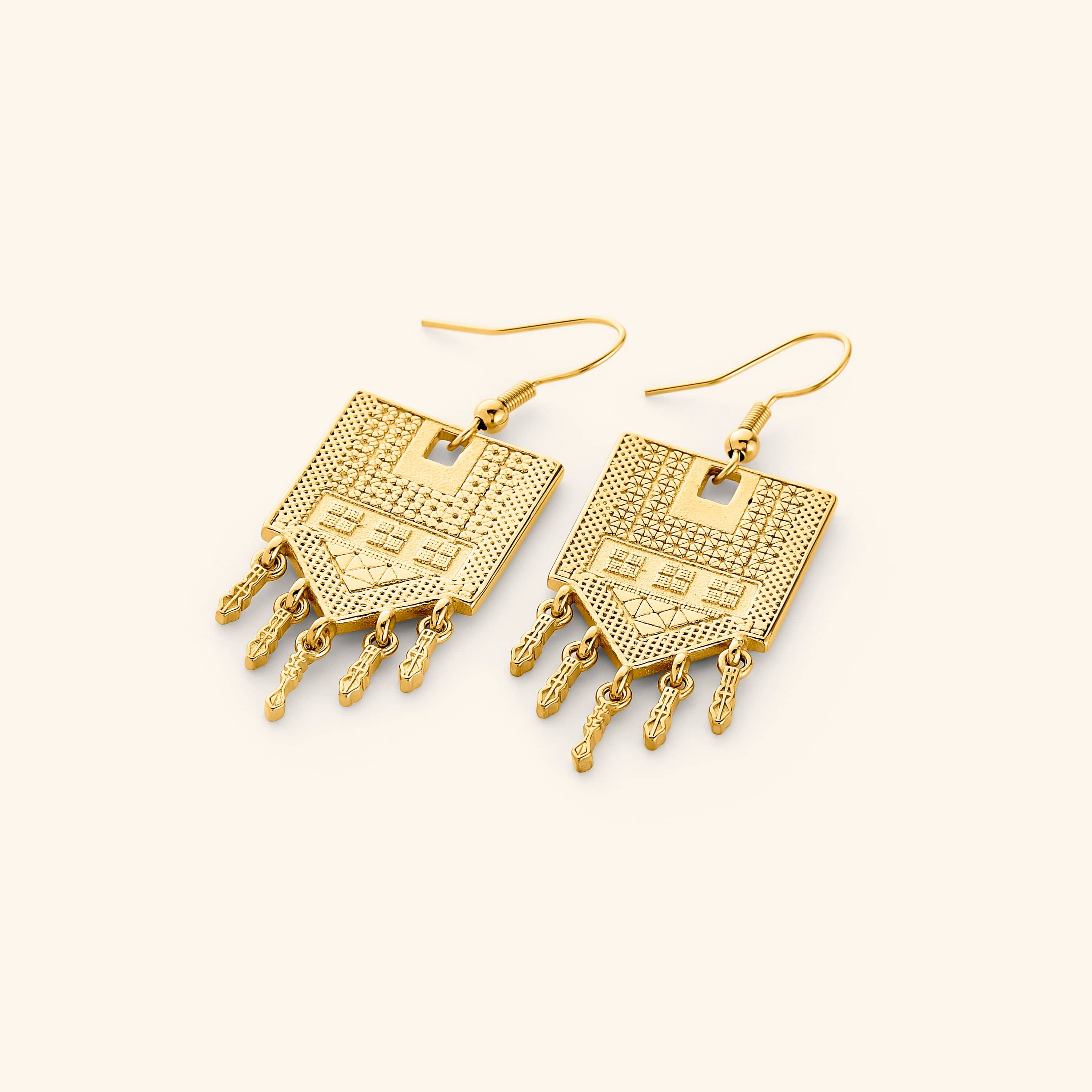 Pair of 18k gold plated statement earrings carved with motifs of tatreez.