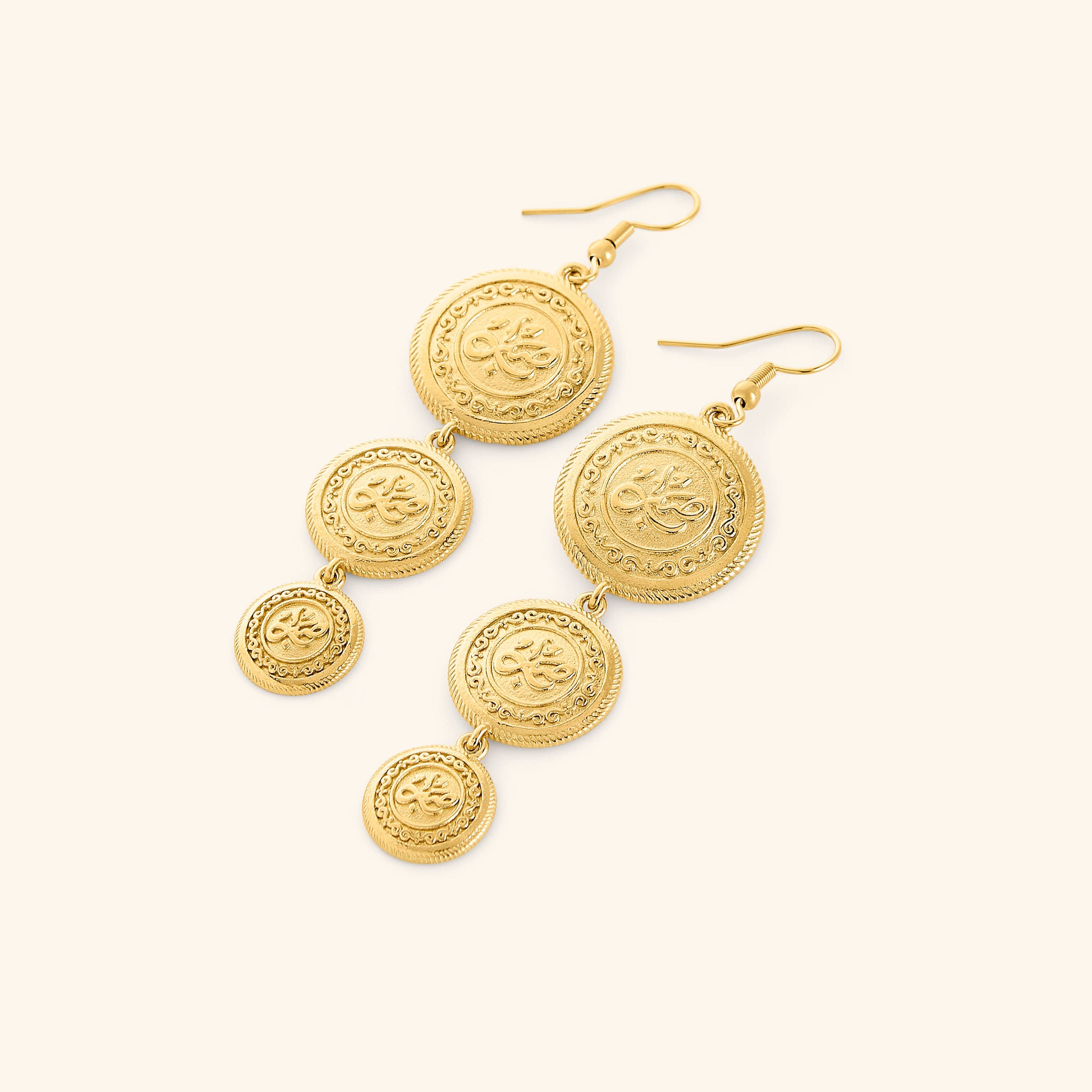 A pair of tri-coin 18k gold plated earrings  embossed with Arabic calligraphy "Sabr". The coins drape from each other with a gold double-chain.