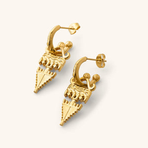 Gold Tatreez Earrings featuring textured geometric drops hanging from engraved hoop studs, shown against a neutral background.
