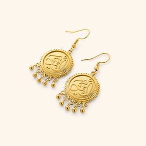 A pair of 18K gold plated dangling coin earrings that features "my mother" embossed in Arabic Calligraphy design finished with dancing orbs.