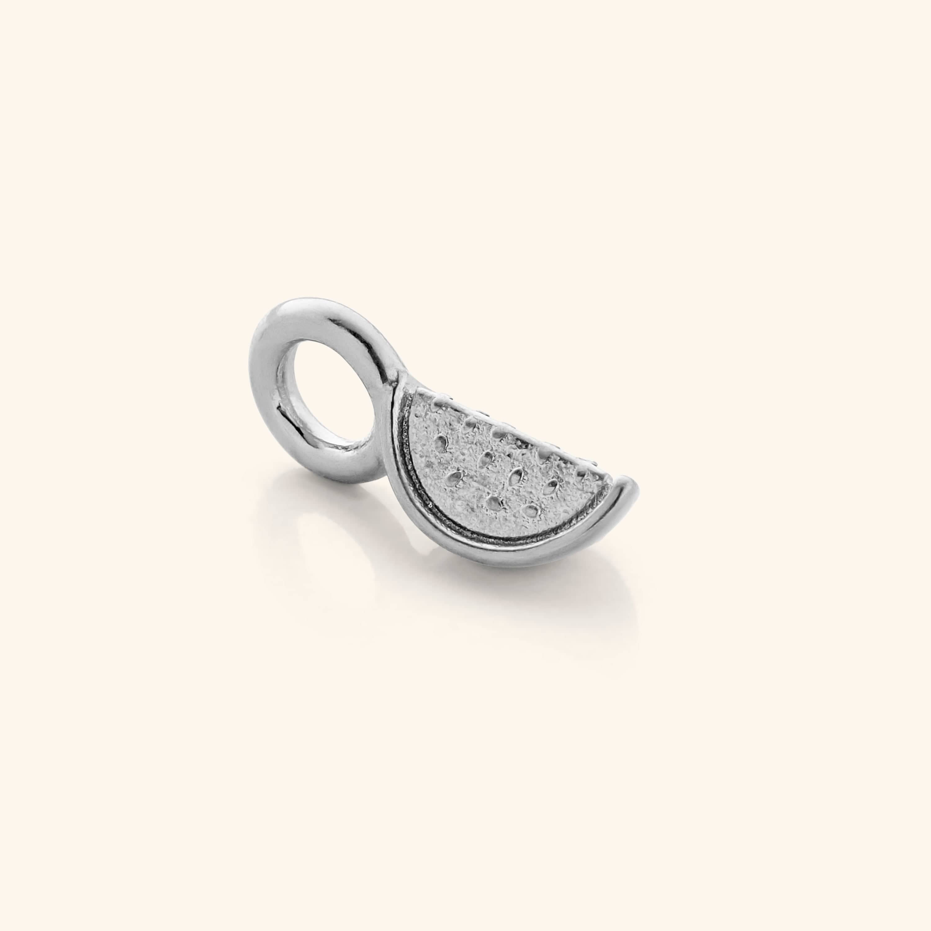 The silver Watermelon Earring Hoop Charm against a light background.