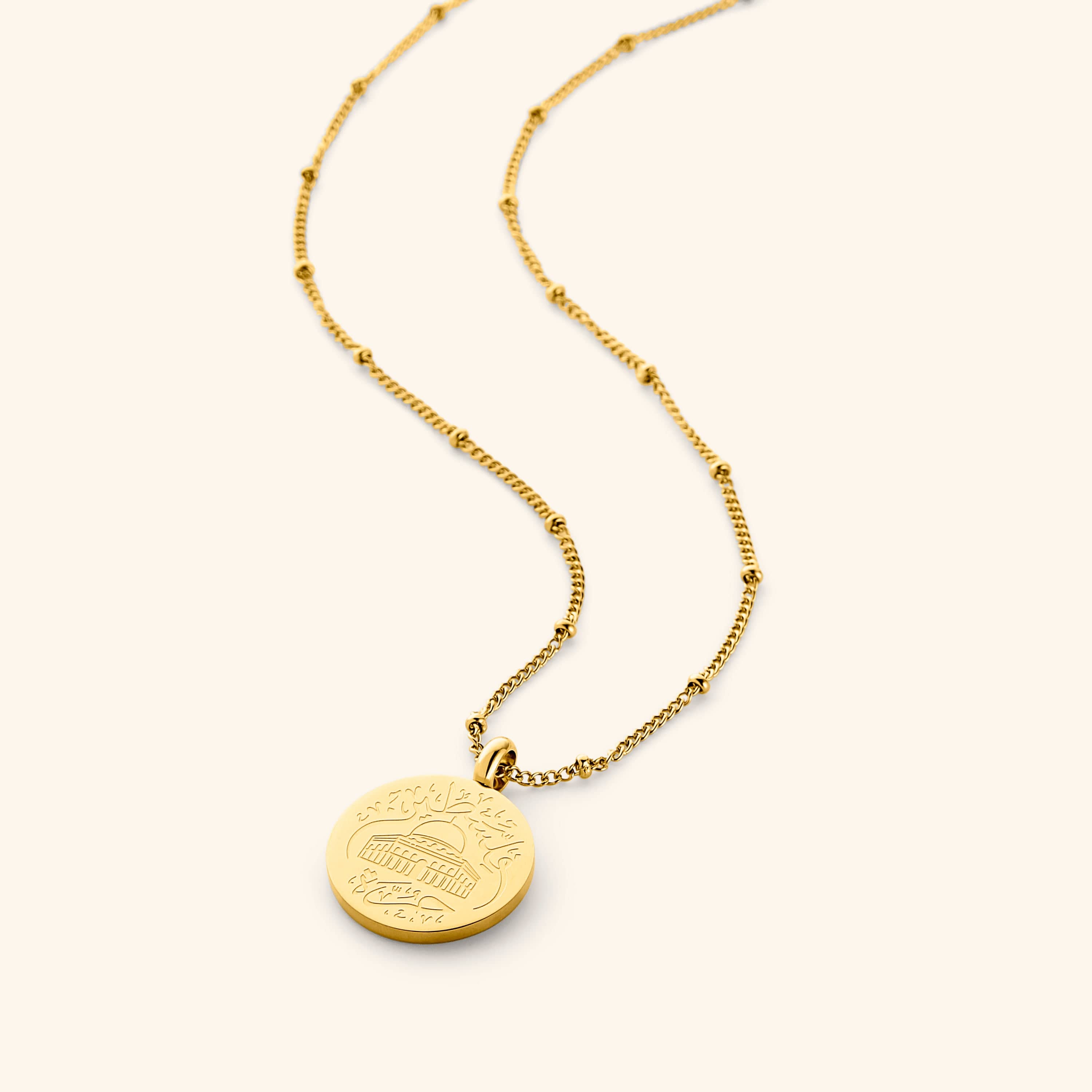 Gold Al-Aqsa ‘Free Palestine’ Necklace with neaded chain on a white background